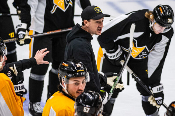 A man in the middle of a group.