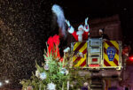 Santa on a fire truck.