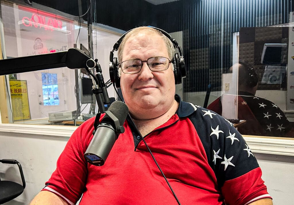 A man with headphones on.