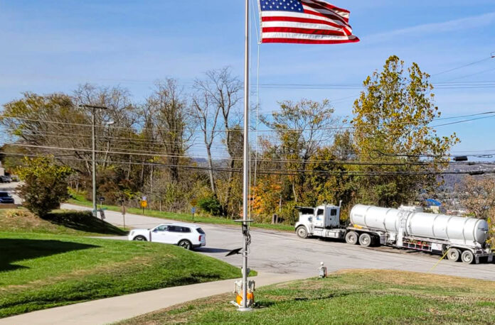 A tractor trailer in a neighborhood.