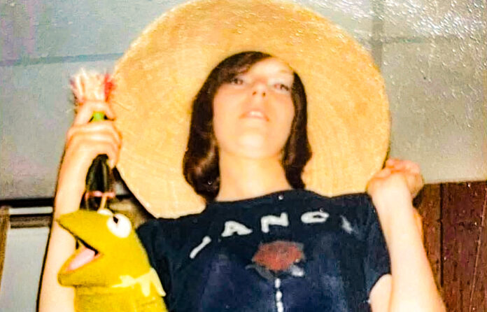 A female with a hat.