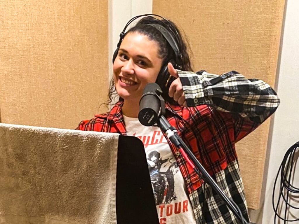 A women in the recording studio.