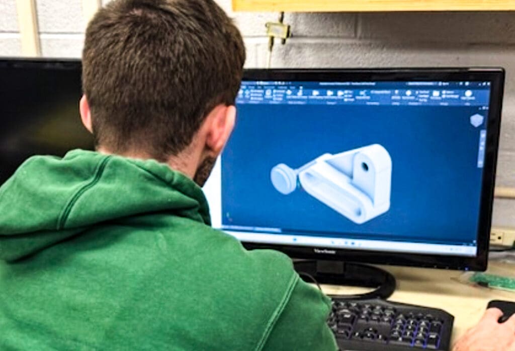 A student at a computer.