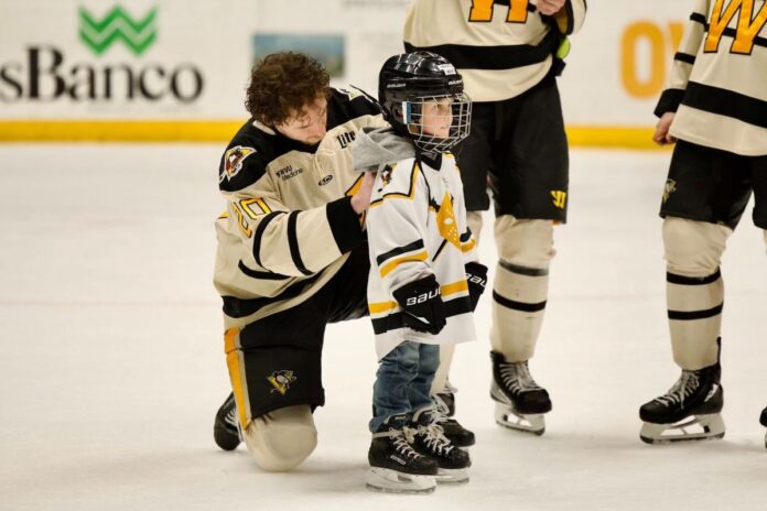 A kid and a hockey player.