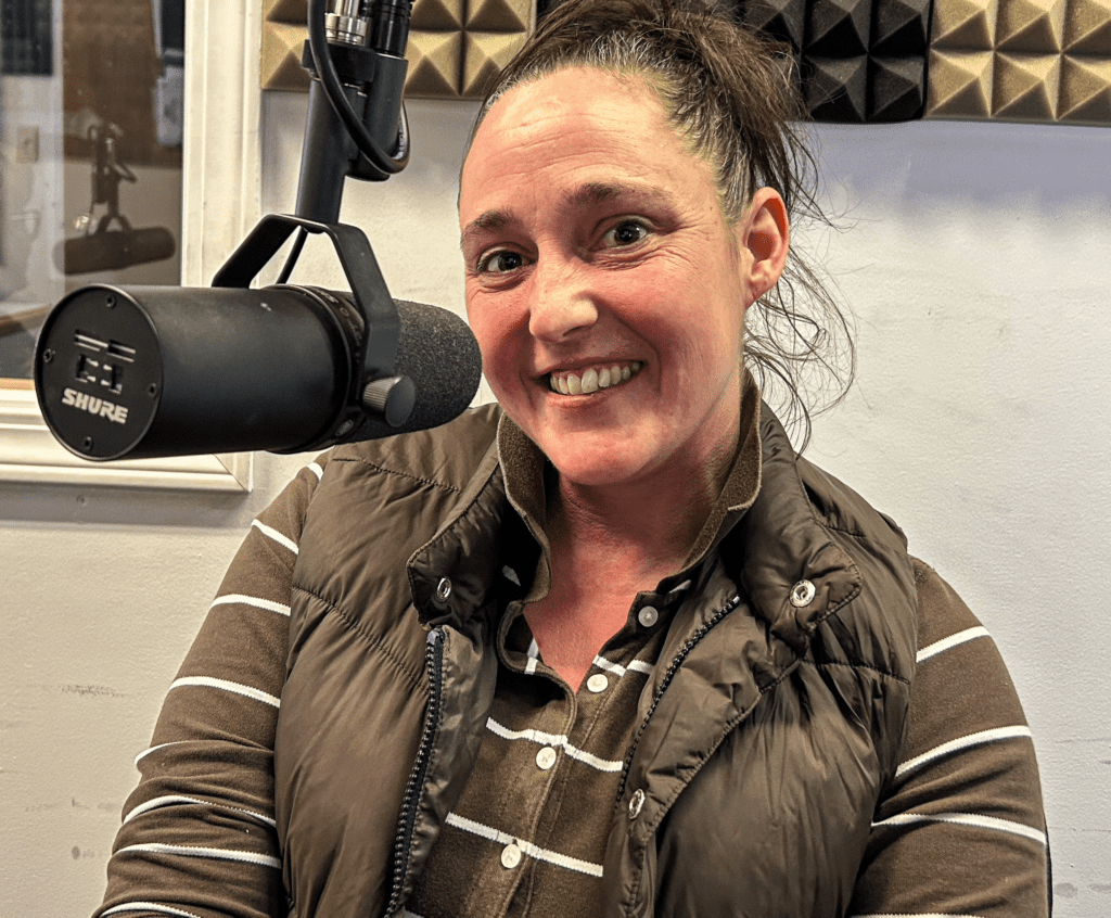 A lady at a microphone.