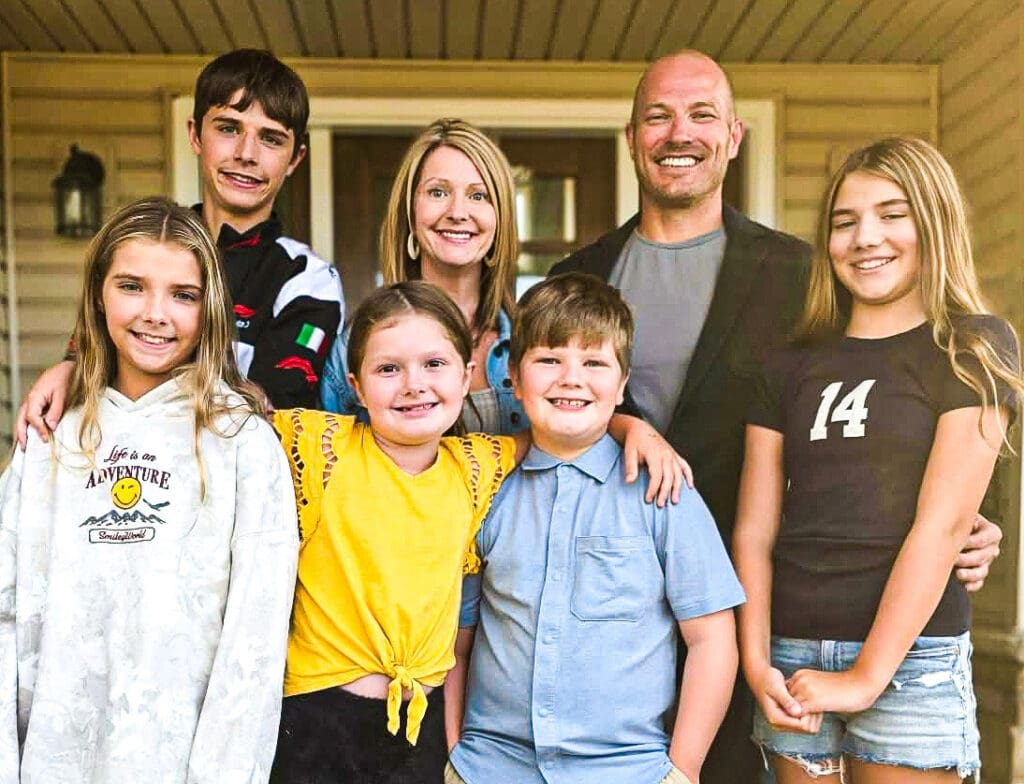 A man and his family.