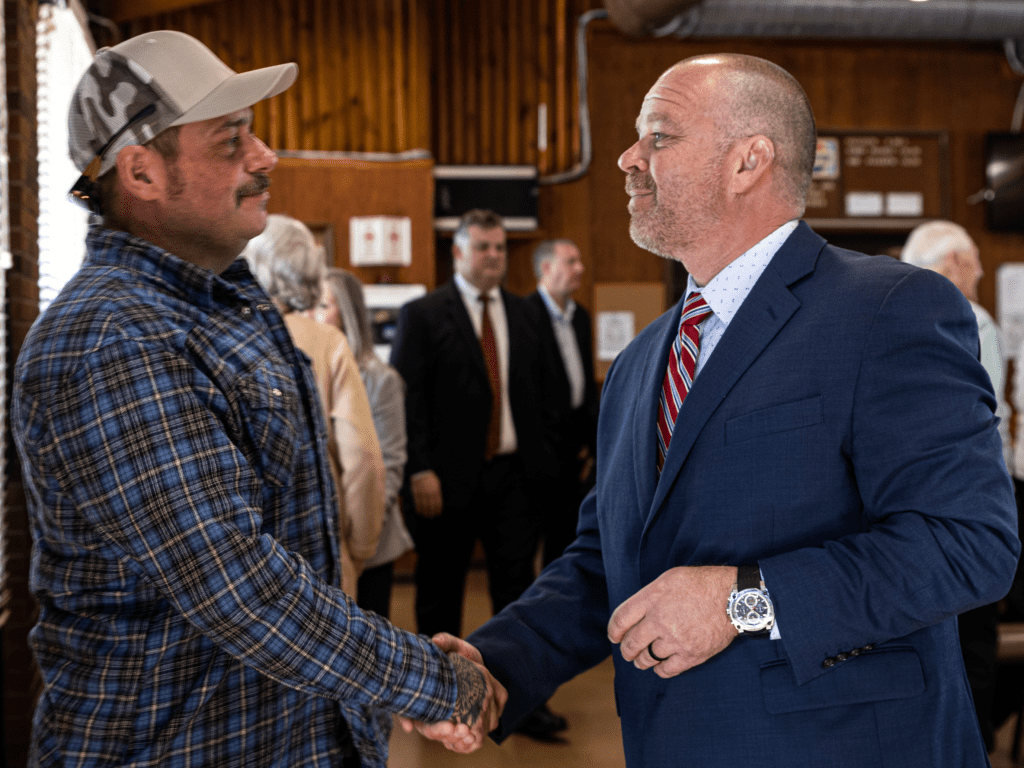 Two men shaking hands.