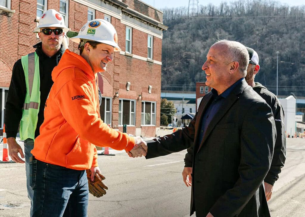 A man shaking hands.