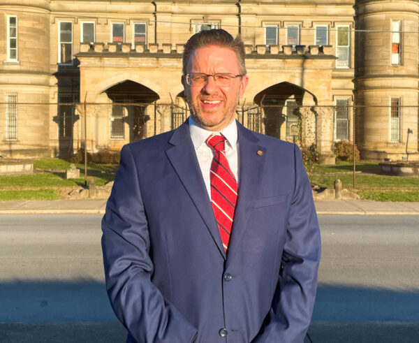 A man in front of a building.