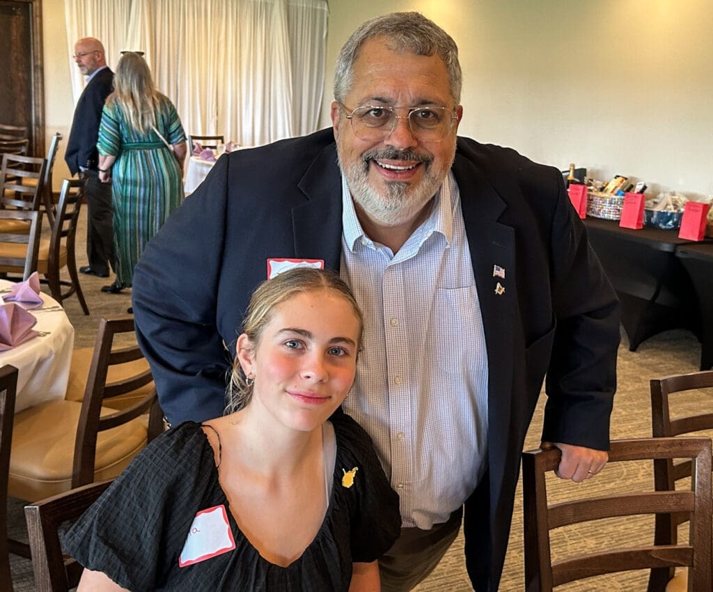 A man and his granddaughter.