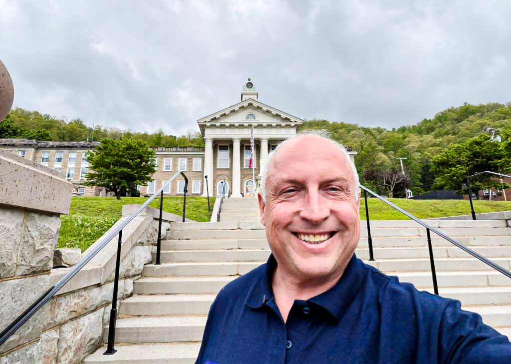 A man in front of a building.