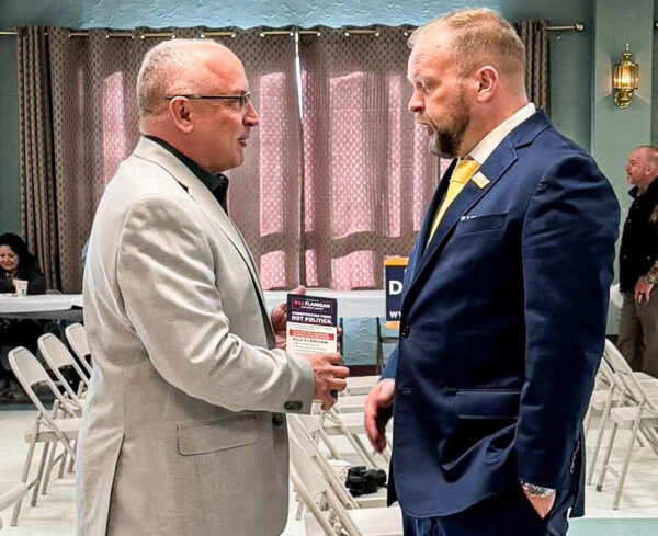 Two men speaking.