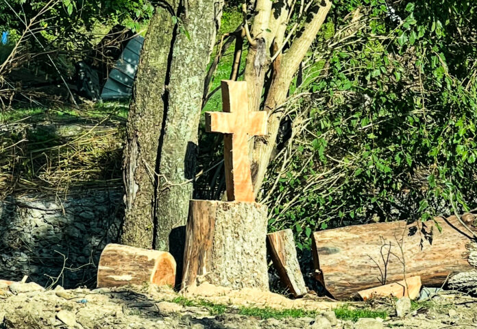 A carved cross from the flooding.