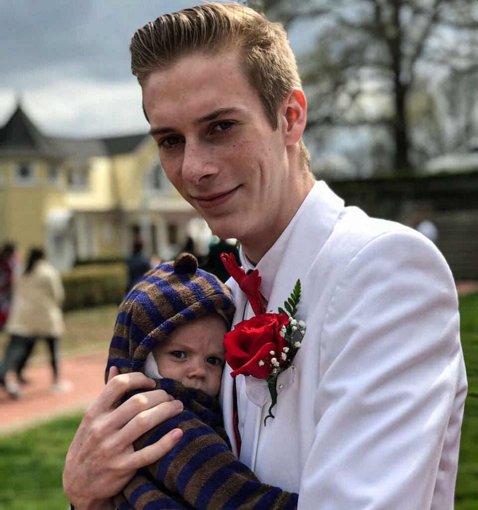 A man and a baby.