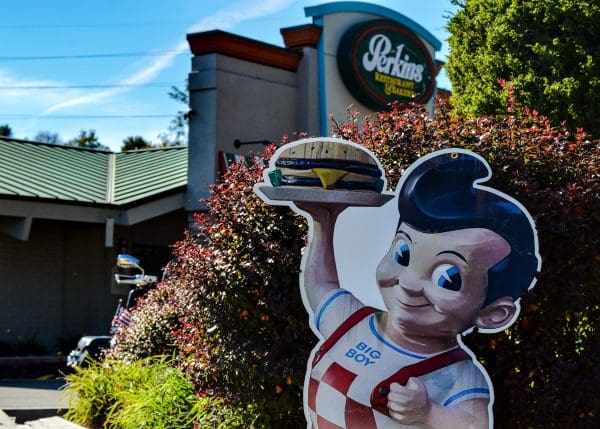 A photo of a Big Boy and a restaurant.