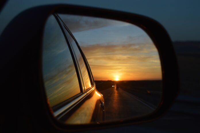 The sun in a rear view mirror.