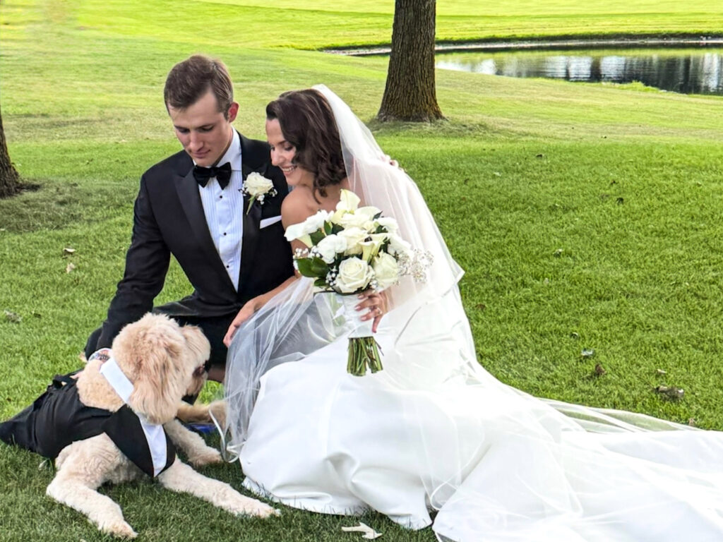 A man, a woman, and a dog.