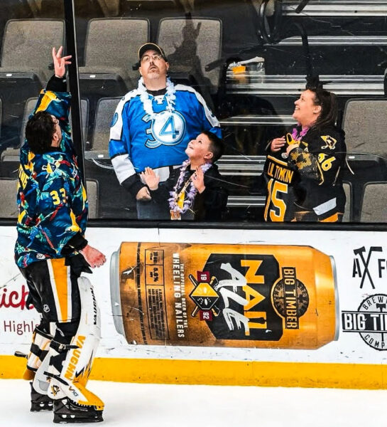 A player tossing a puck.